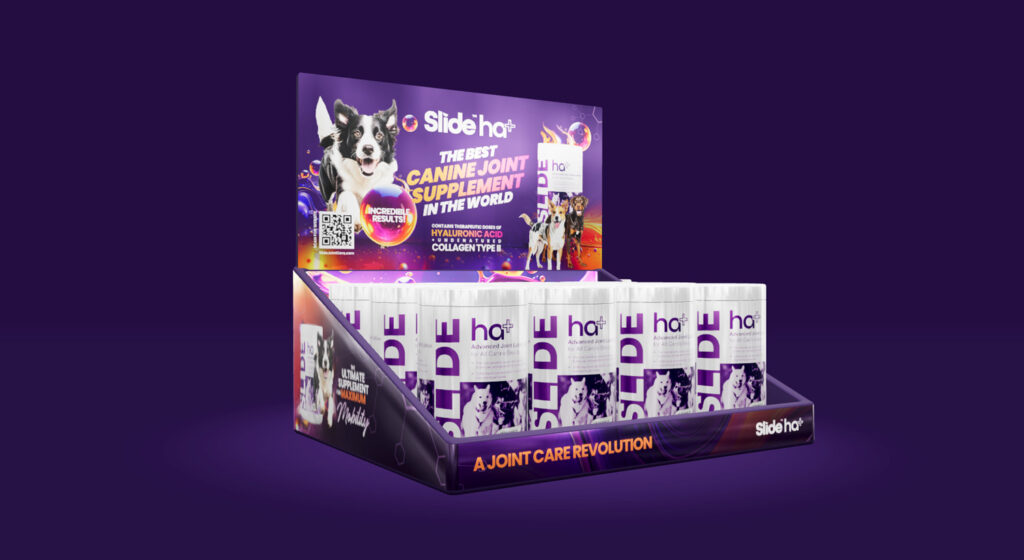 Purple display box with multiple small bottles arranged in rows for retail product presentation